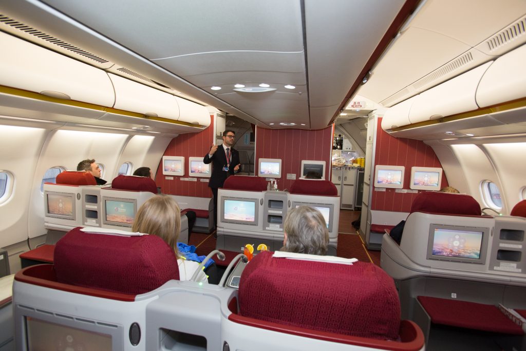 Picture of Diogo Castanheira, Hainan Airlines' Accounts Manager for UK and Ireland giving a talk to members of the press in Business Class - Picture from Manchester Airport. 