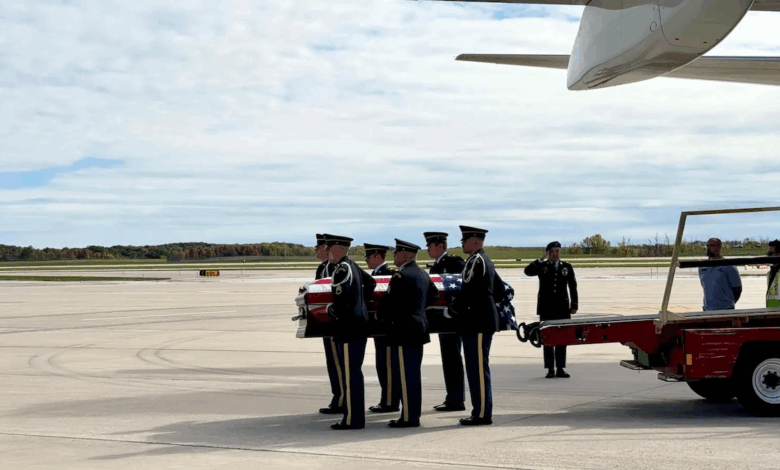 A military honor guard carries Pfc. Dulyea's casket