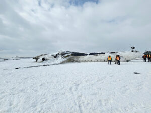 TSB investigators examining the wreckage of Endeavor Air/Delta Connection Flight 4819 at Toronto Pearson International Airport