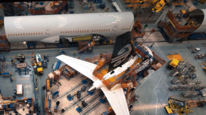 Sections of the enhanced 787-9 are loaded into Final Assembly